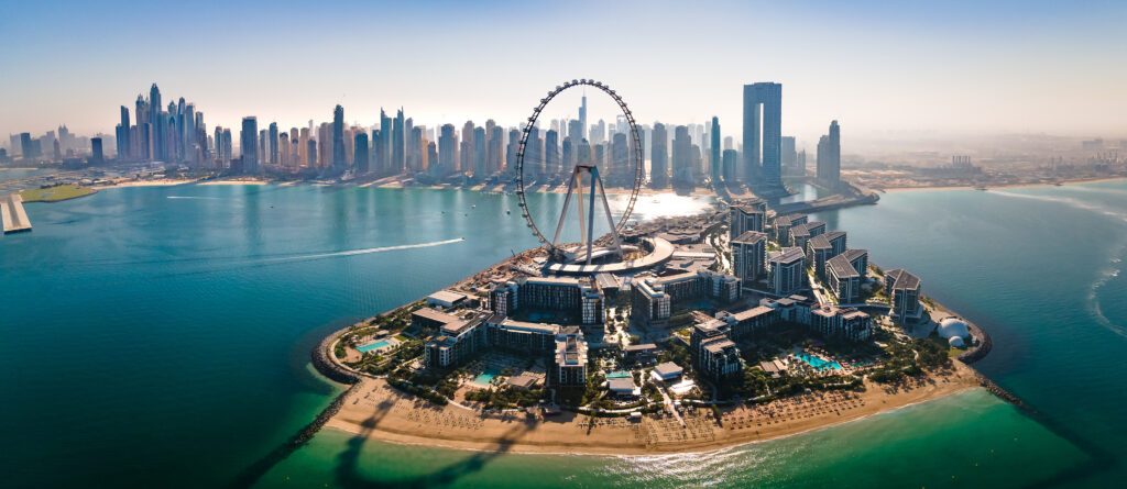 Bluewaters island and Ain Dubai ferris wheel on in Dubai, United Arab Emirates with JBR beach and Dubai marina aerial skyline cityscape view